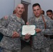 Raider Soldier escorts wounded Iraqi Police officer to Baghdad