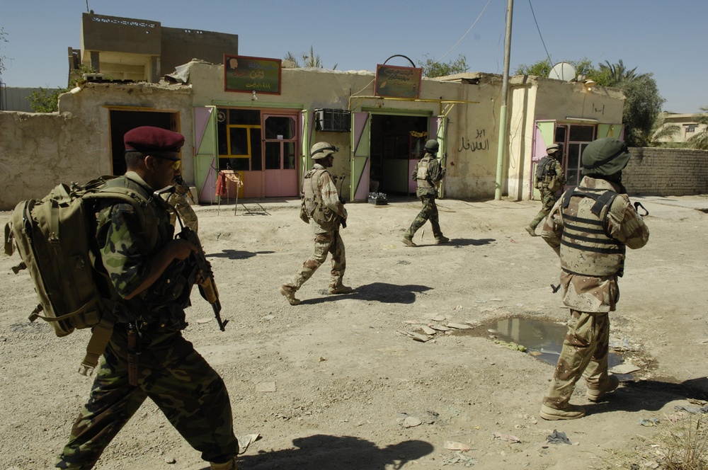 U.S., Iraqi Soldiers patrol streets of southwest Baghdad