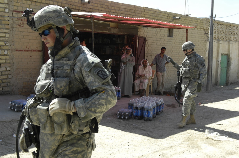 U.S., Iraqi Soldiers patrol streets of southwest Baghdad