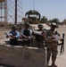 US and Iraqi Soldiers Guard and Support Reconstruction Efforts