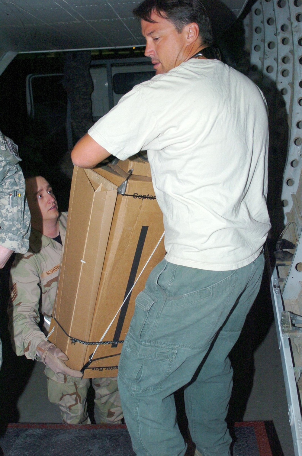 Coalition Forces, Blackwater Aviation Distribute Care Packages to FOBs