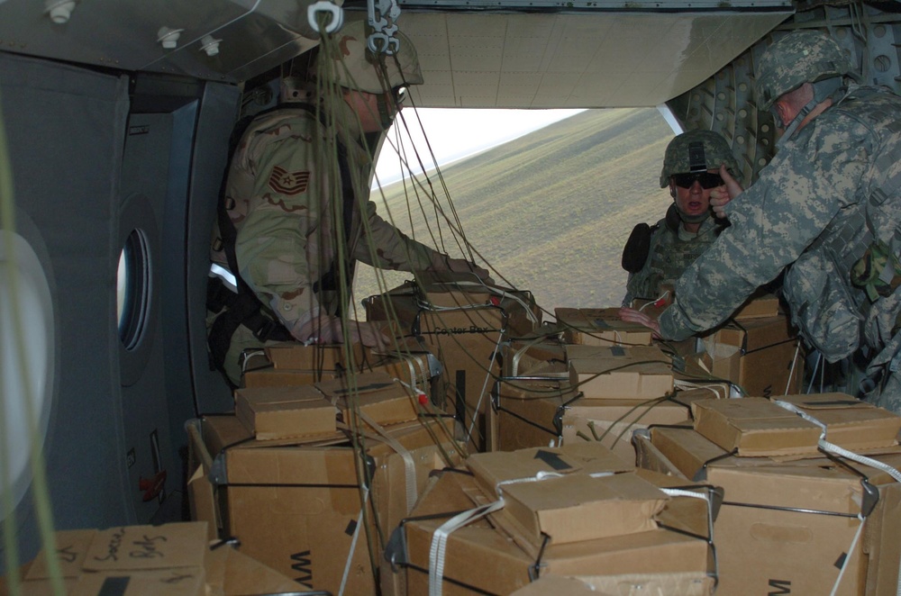 Coalition Forces, Blackwater Aviation Distribute Care Packages to FOBs