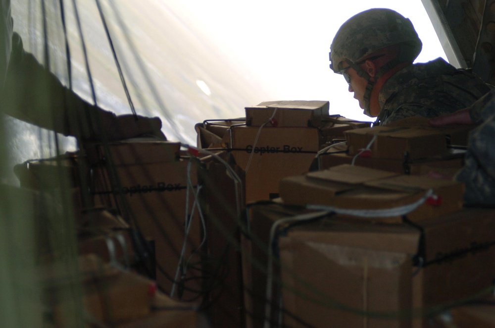 Coalition Forces, Blackwater Aviation Distribute Care Packages to FOBs