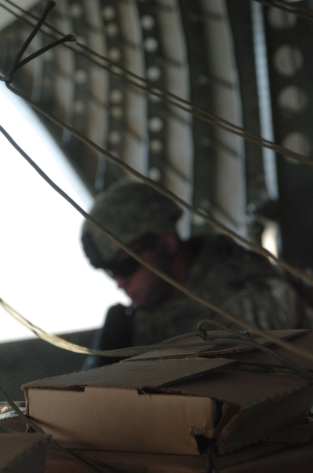 Coalition Forces, Blackwater Aviation Distribute Care Packages to FOBs