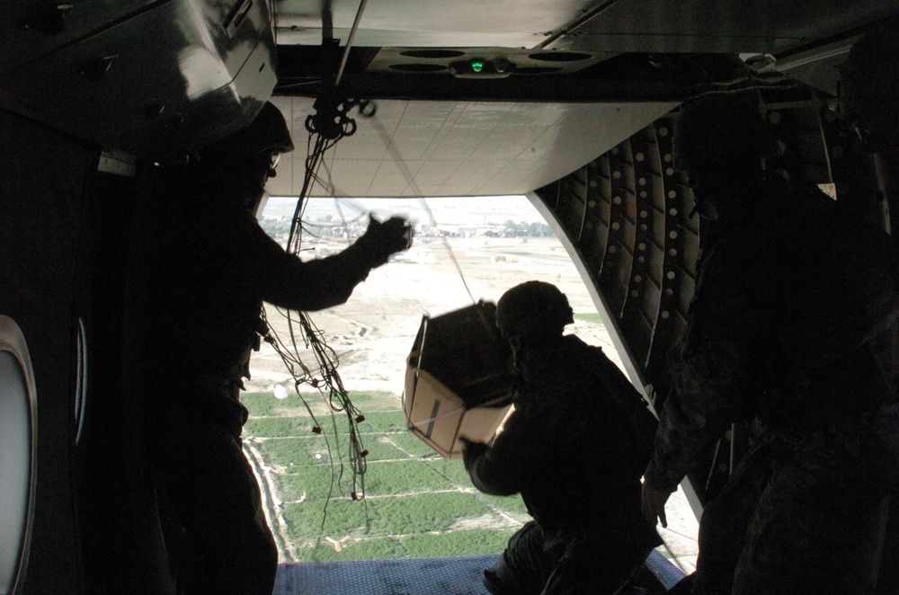Coalition Forces, Blackwater Aviation Distribute Care Packages to FOBs