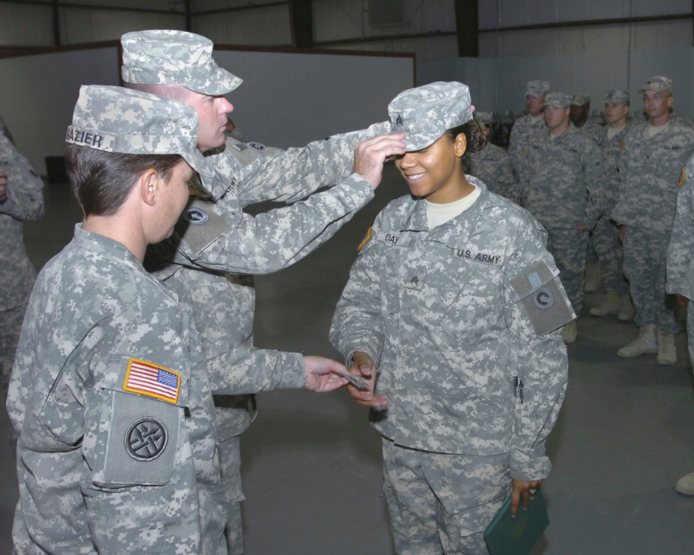 Two Soldiers Put on the Hard Stripes at Camp Arifjan