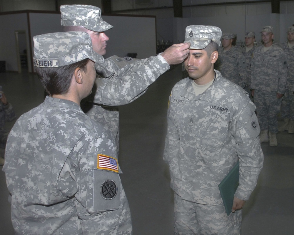 Two Soldiers Put on the Hard Stripes at Camp Arifjan