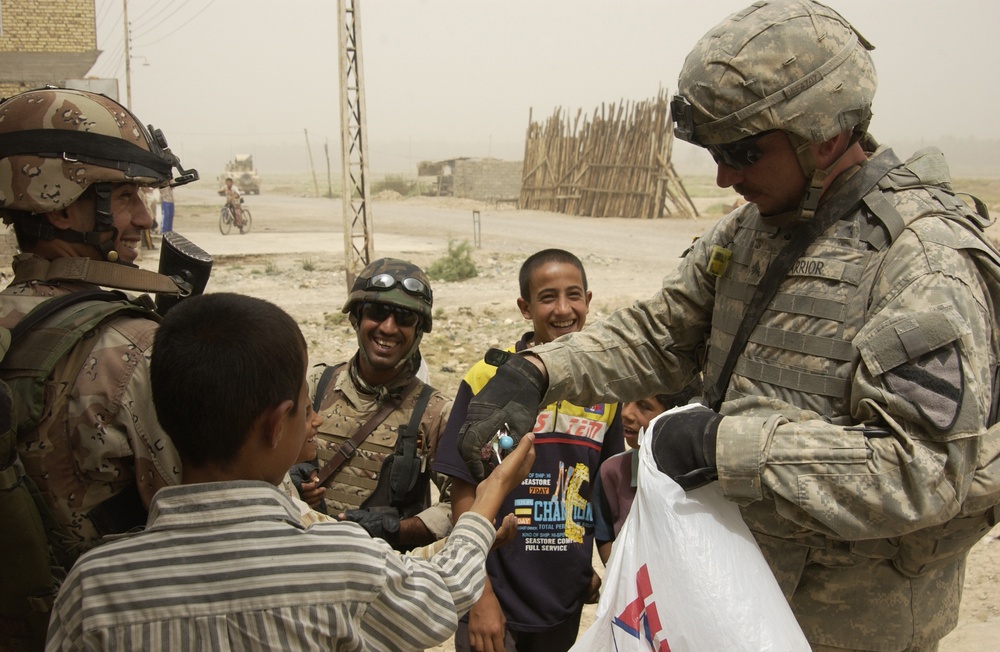 U.S., Iraqi Soldiers on Humanitarian Mission in Haqim