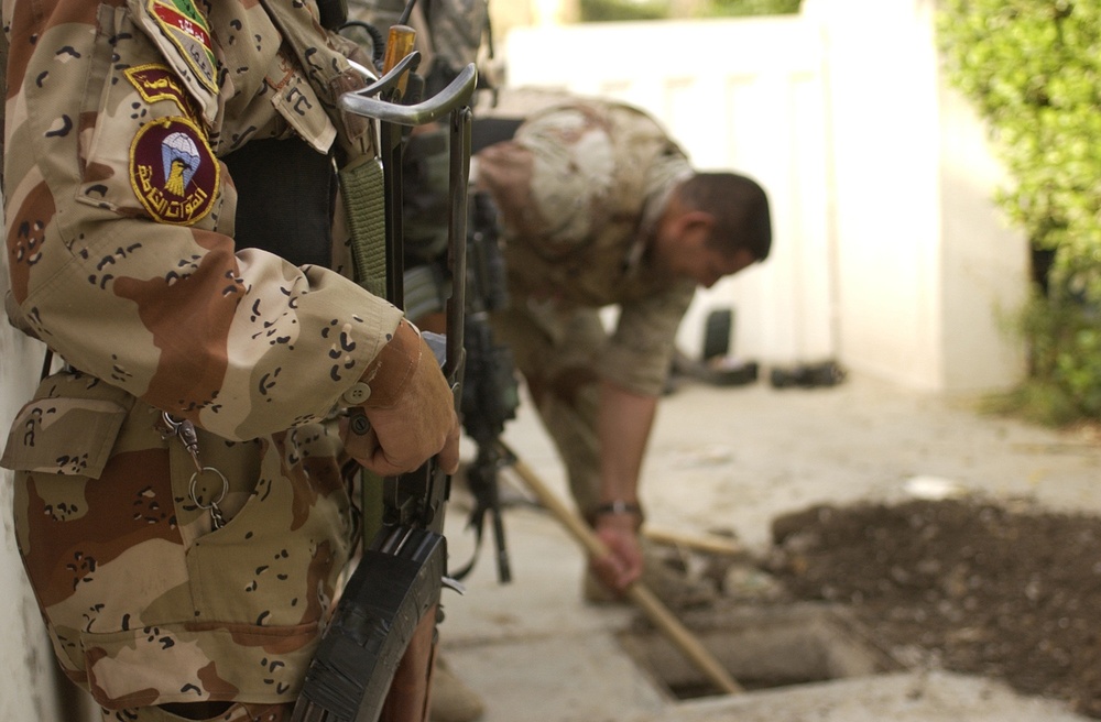 Search for weapon caches in Al Mansour