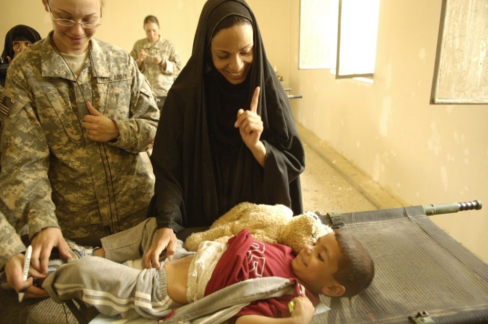 Soldiers Help Young Boy Get Surgery