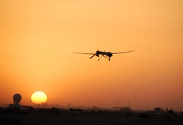 Predator Flies Recon With Sun on Horizon