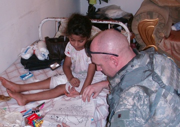 For Rusil: Troops Go the Distance to Care for Wounded Iraqi Girl