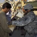 Troops Deliver Food, Water to Poorest Residents of Al Kindi
