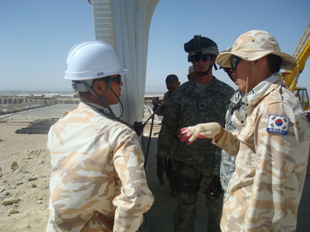 International armed forces engineers work together in Afghanistan