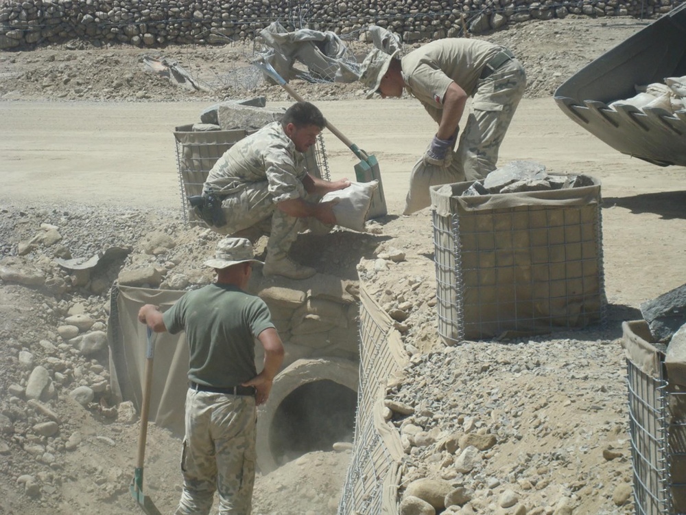 International armed forces engineers work together in Afghanistan