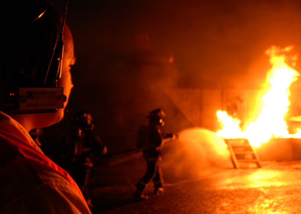 federal firefighters advance to combat fire during aircraft firefighting tr