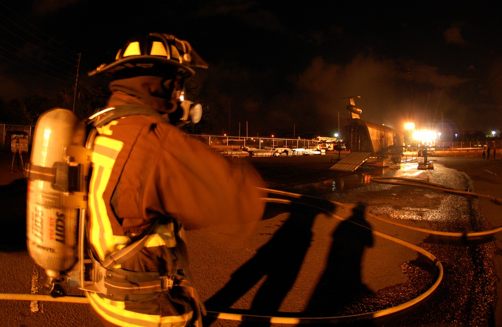 Federal Firefighter waits to participate in aircraft firefighting training