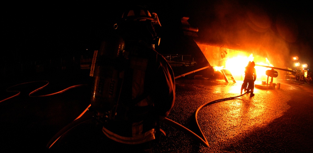 Federal Firefighter combat fire during aircraft firefighting training evolu
