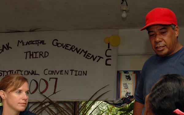Lt. Elizabeth Solze explains a patient's diagnosis to a translator