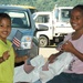 Micronesian children wave American flags