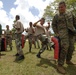 Recruits run through martial arts pad drills