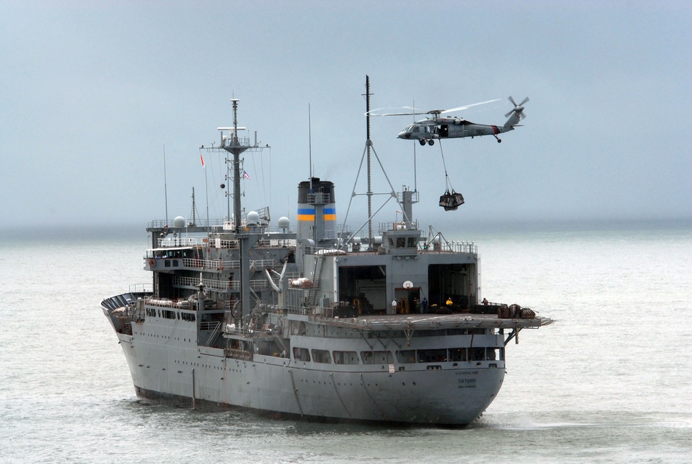 USNS Saturn delivers supplies to USNS Comfort