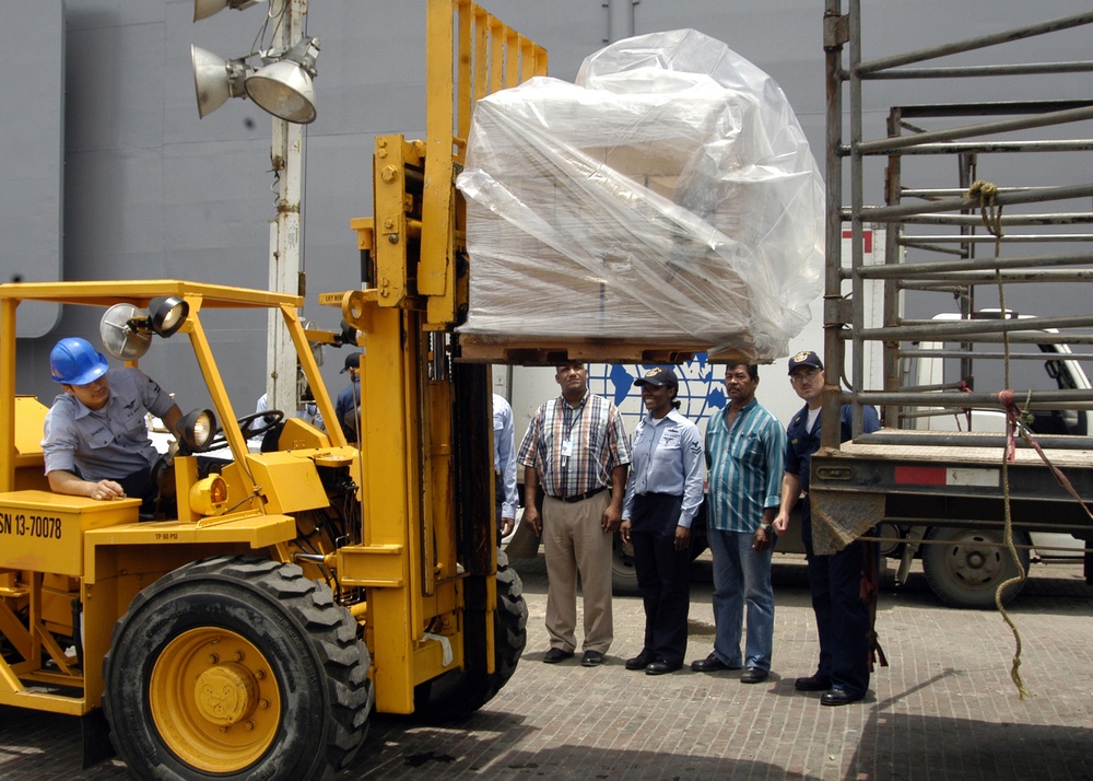 Sailors Load Educational Supplies for Operation Handclasp