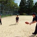 Sailors play catch with Japanese children