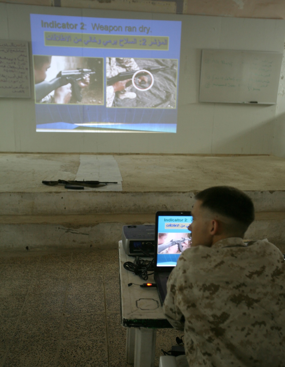 Iraqi policemen attend small arms weapons intructor course