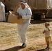 Iraqi Soldiers Hand Out Food After Clearing Operation