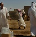 Iraqi Soldiers Hand Out Food After Clearing Operation