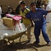 Iraqi Soldiers Hand Out Food After Clearing Operation