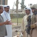 Marines and Iraqi police distribute food bags