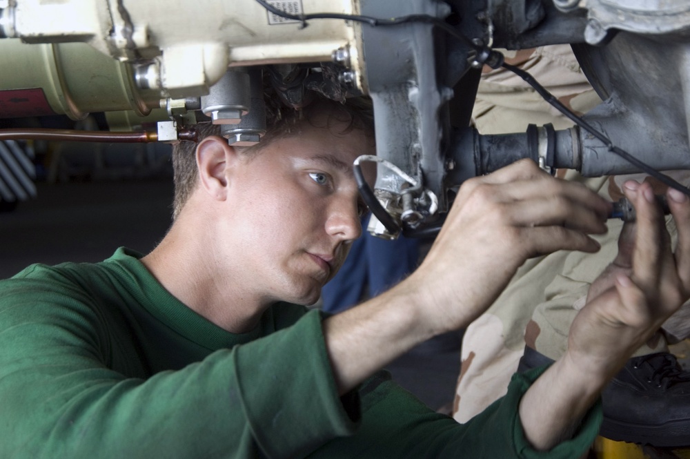 Kitty Hawk Sailor Maintains Aircraft