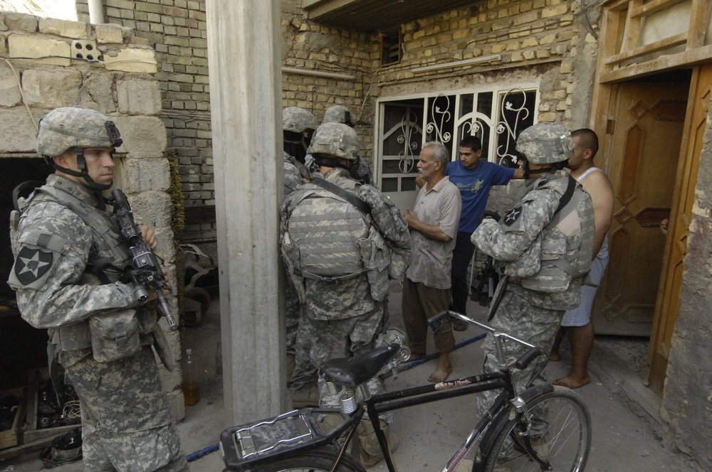 Soldiers patrol the city of Dora