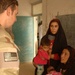 special forces visit village and distribute humanitarian assistance