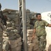 82nd Airborne Troops Help Put Up Guard Towers