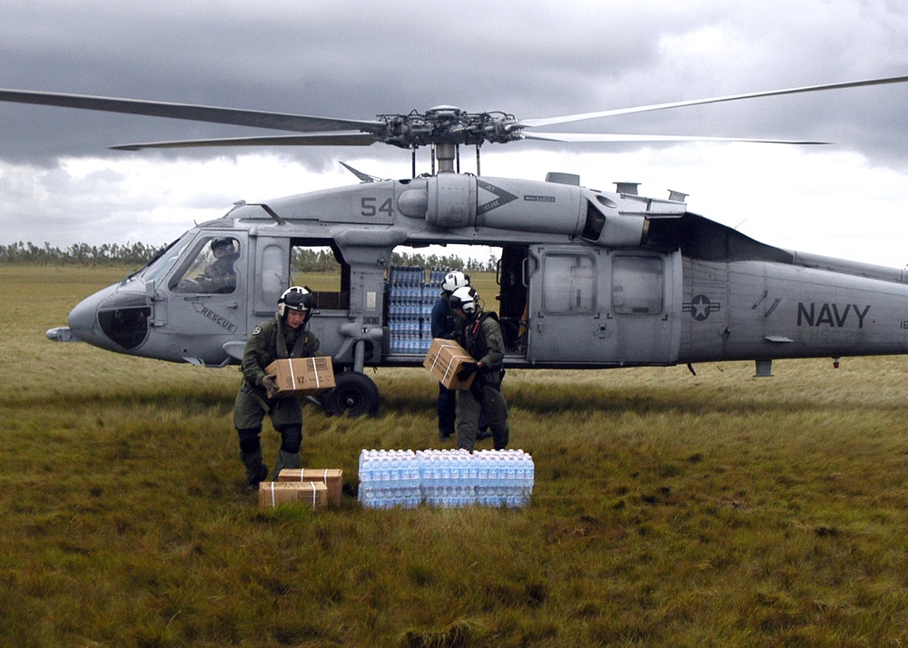 Navy Aircrew Delievers Supplies, Transports Injured