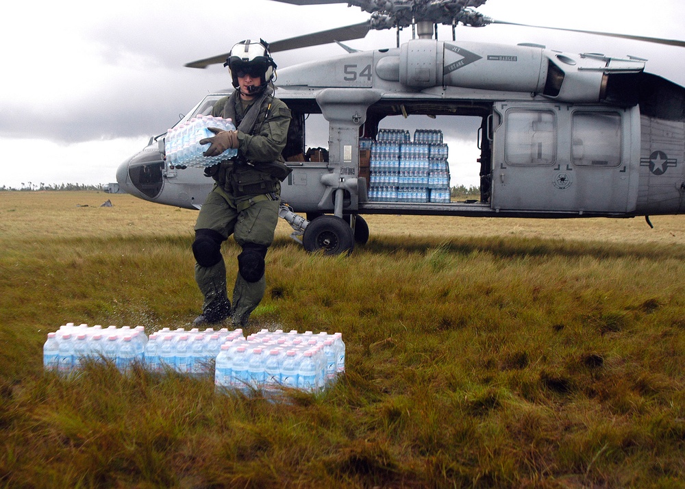 Navy Aircrew Delievers Supplies, Transports Injured