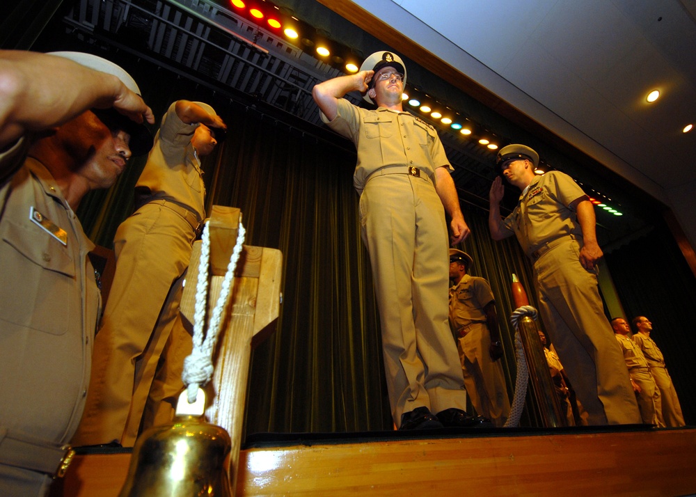 Newly pinned chief petty officer piped aboard