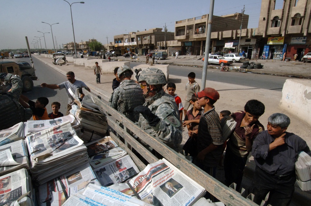 Soldiers Distrubute Baghdad Now