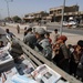 Soldiers Distrubute Baghdad Now
