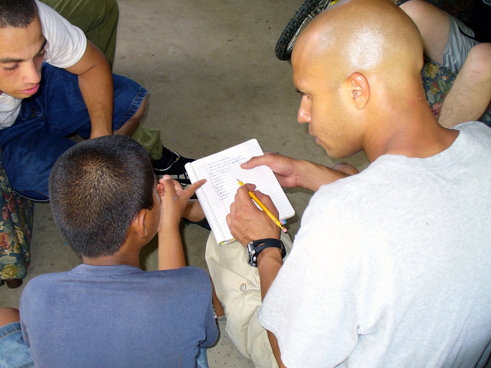 DVIDS - Images - Sailor Helps Panama Child with Homework