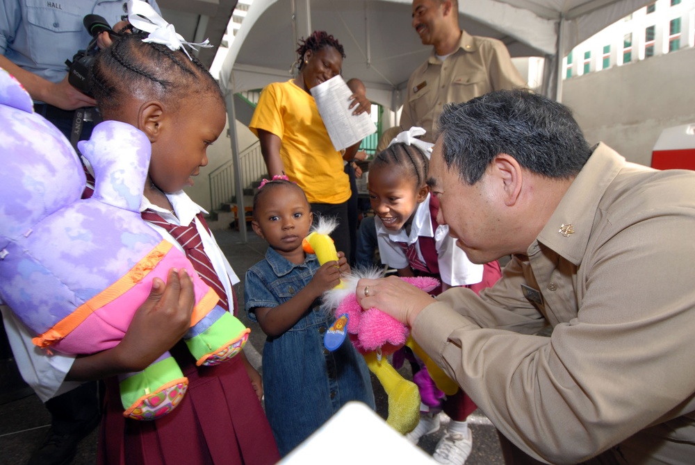 Personnel from USNS Comfort provide medical care