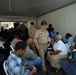 Personnel from USNS Comfort provide medical care