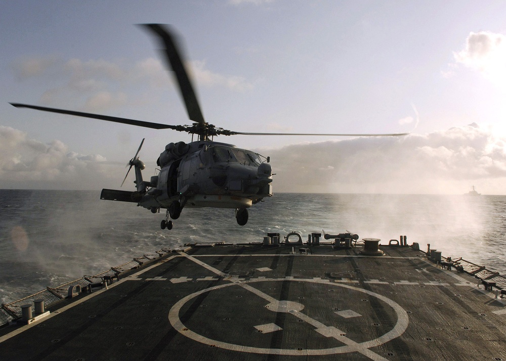 SH-60B Seahawk lands on flight deck of guided-missile destroyer USS Arleigh