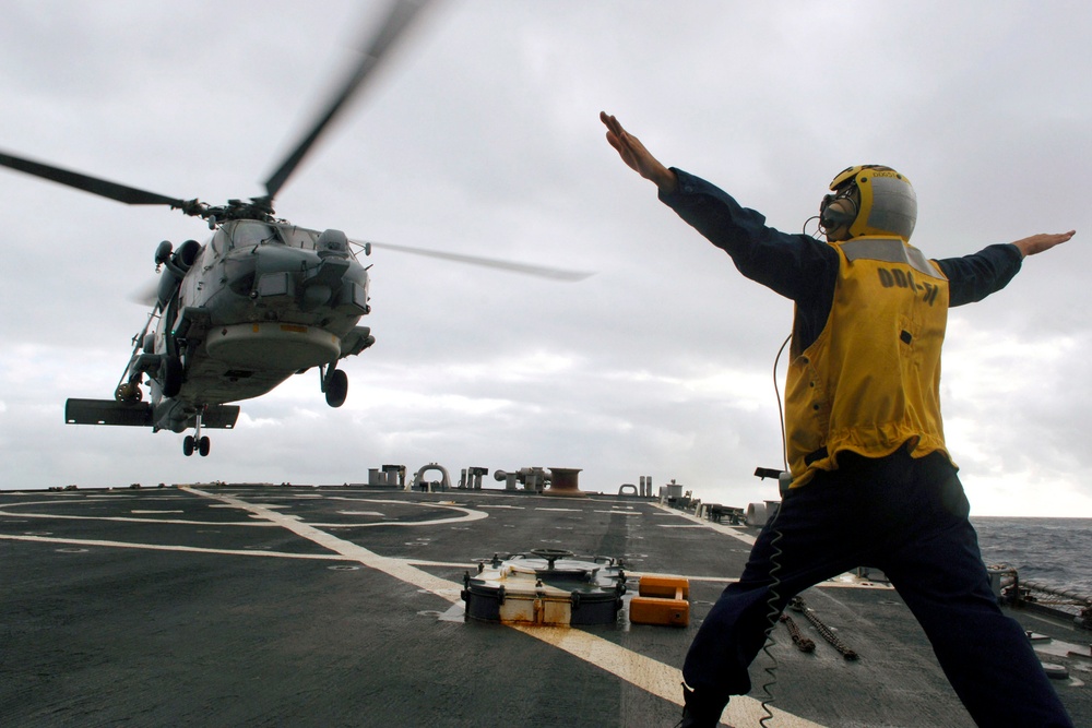 SH-60B Seahawk lands on flight deck of guided-missile destroyer USS Arleigh