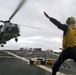 SH-60B Seahawk lands on flight deck of guided-missile destroyer USS Arleigh