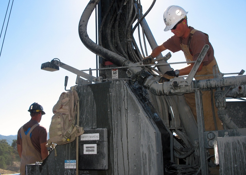 Petty Officer disconnects a water pump line
