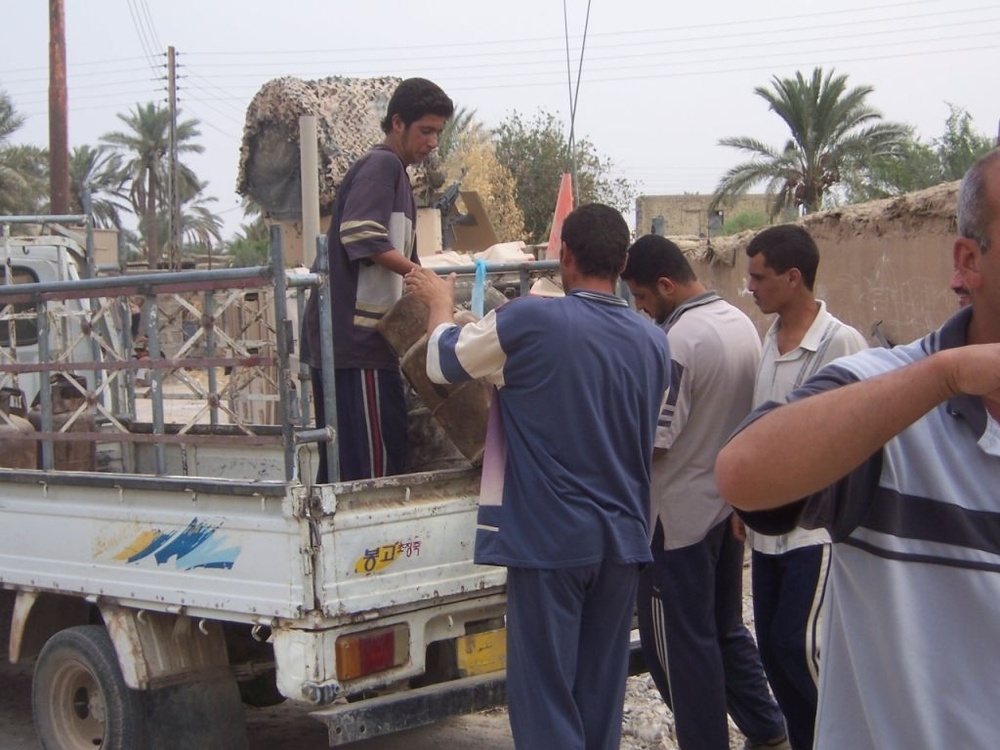 Coalition Forces give humanitarian aid to village